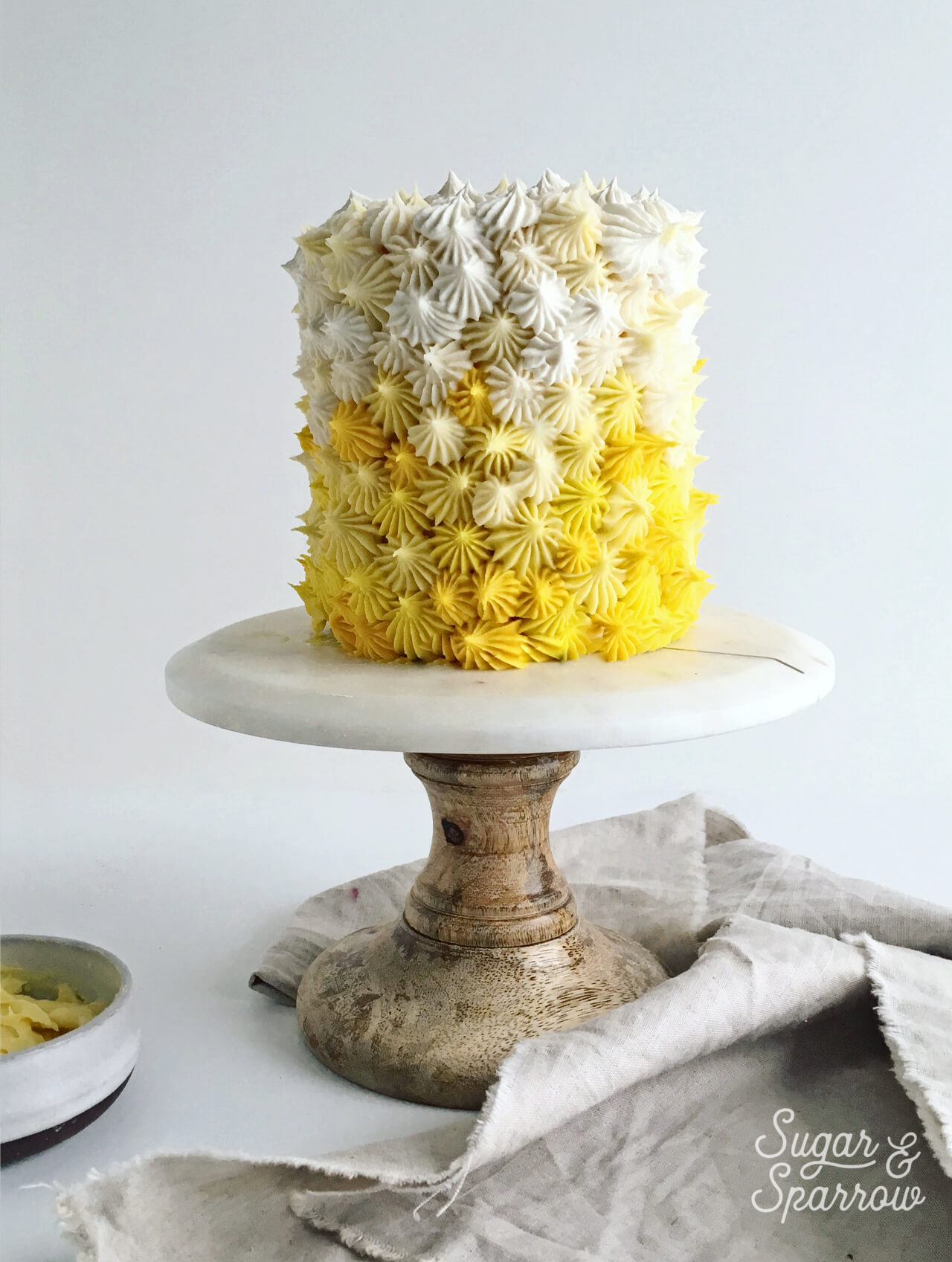 mango buttercream cake by sugar and sparrow