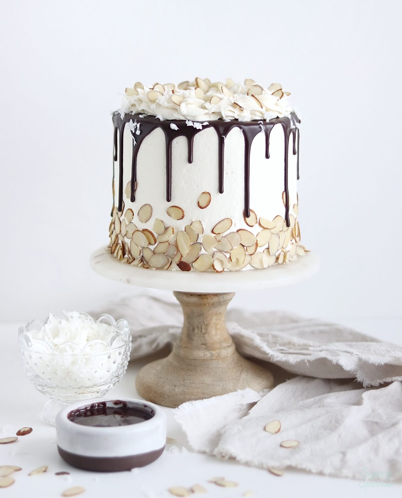 coconut chocolate cake by sugar and sparrow