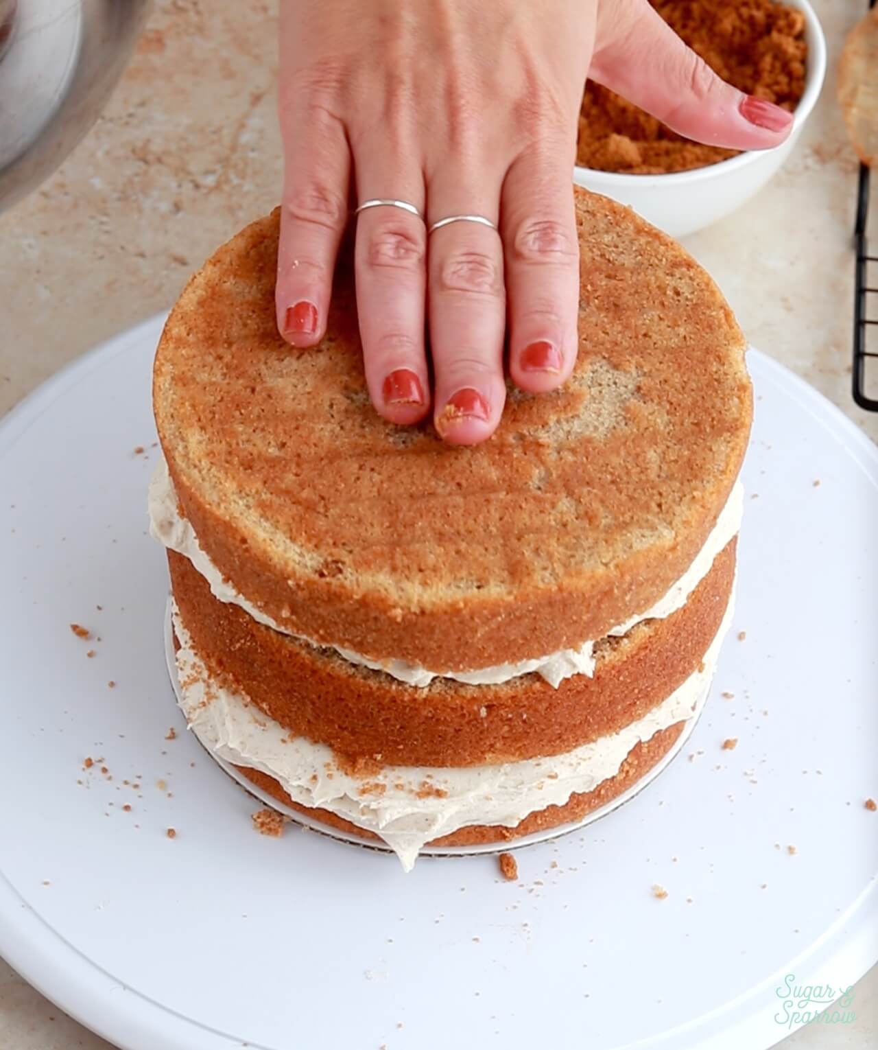 filling and stacking a three layer cake