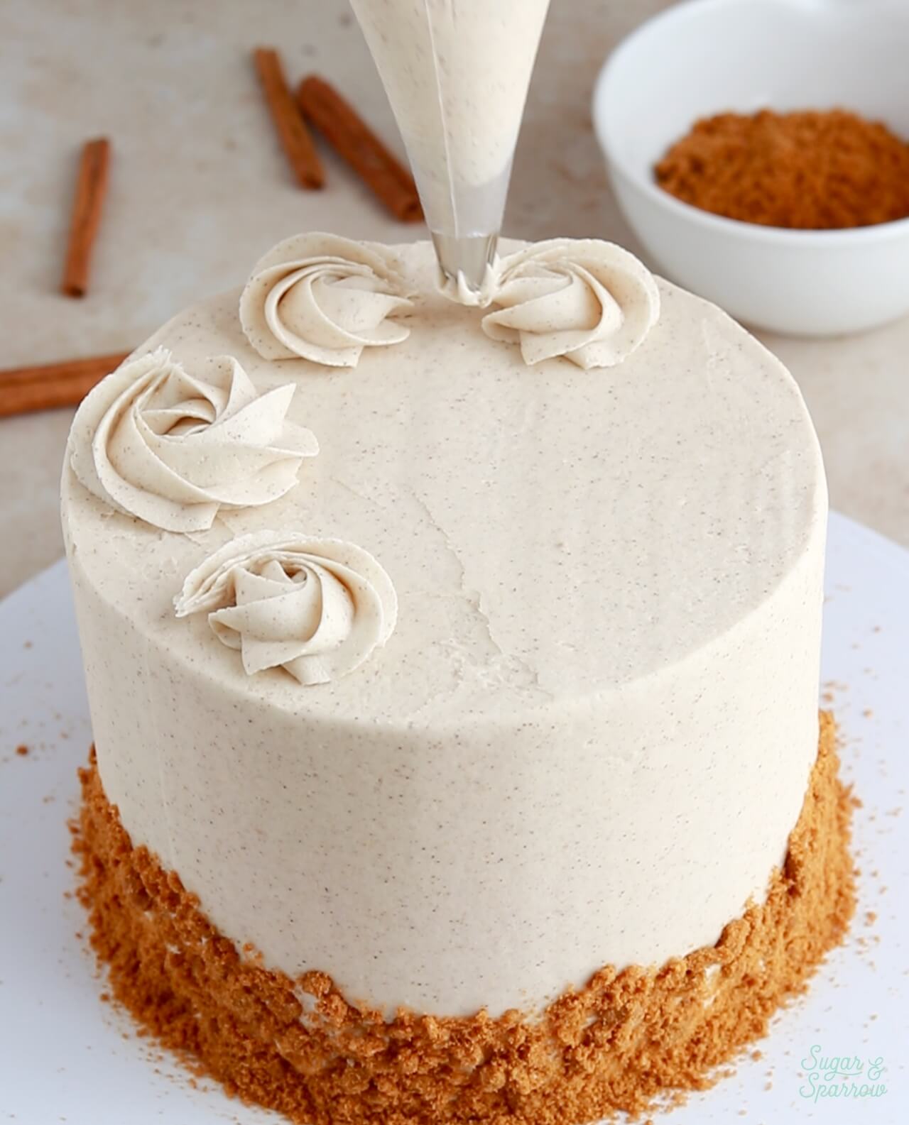 piping rosettes on a cake with wilton tip 1m