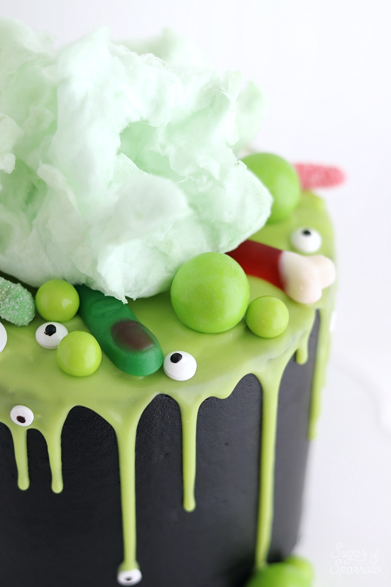 Witch cauldron cake topped with cotton candy