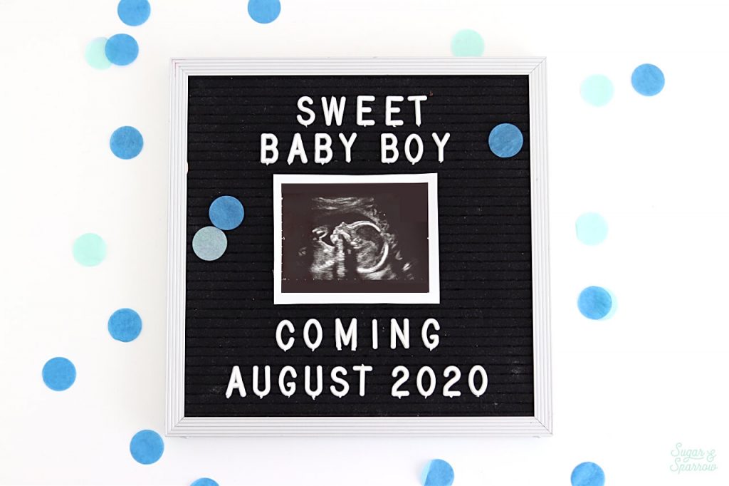 gender reveal with letterboard sign