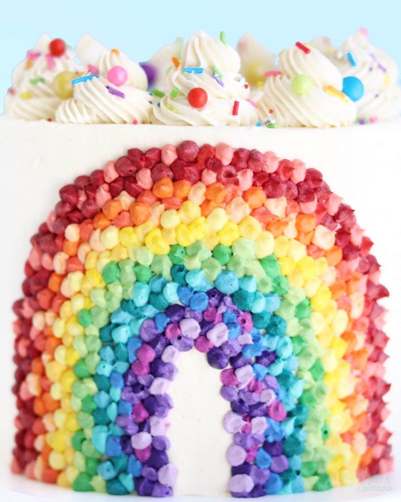 buttercream rainbow cake by sugar and sparrow