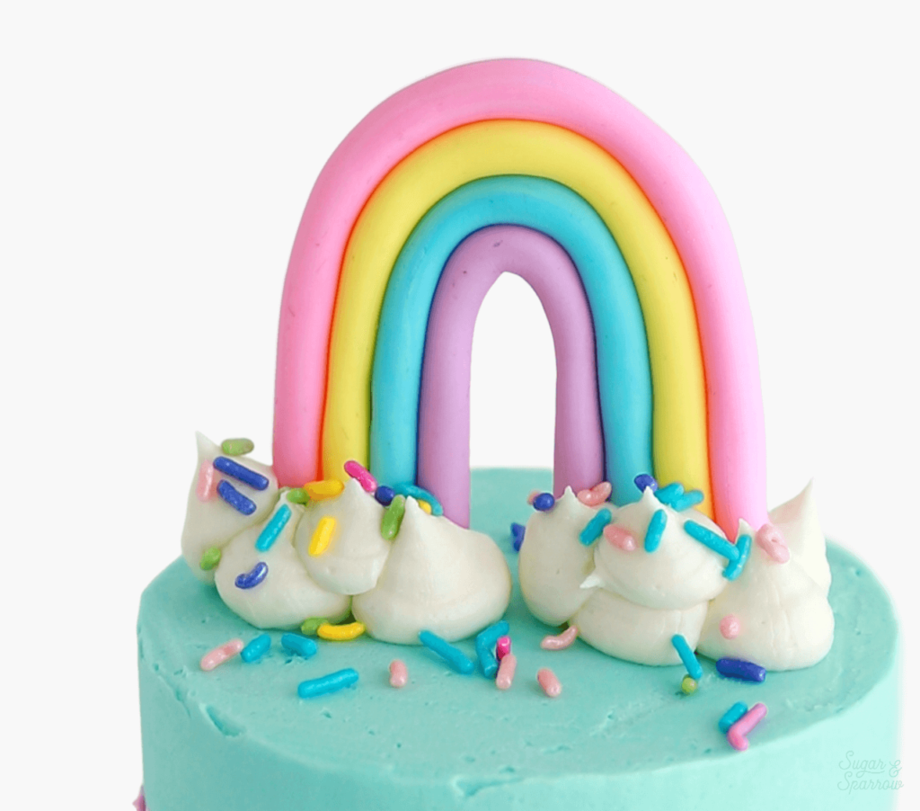 rainbow cake topper by sugar and sparrow