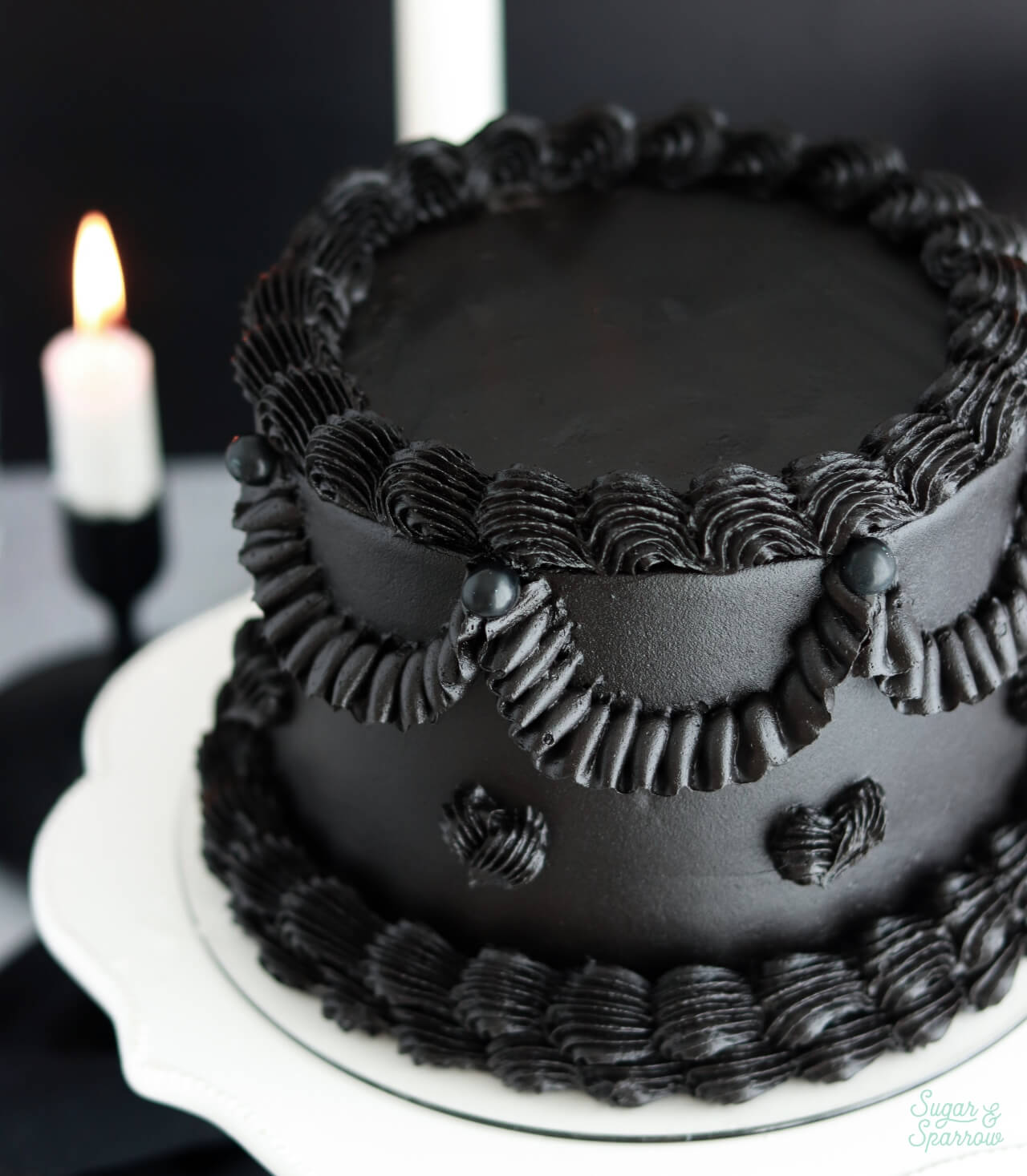 black cake with vintage piping