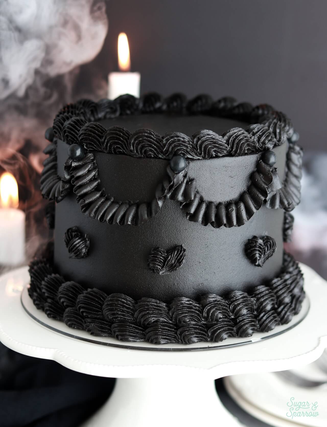 black velvet cake with black buttercream and vintage piping