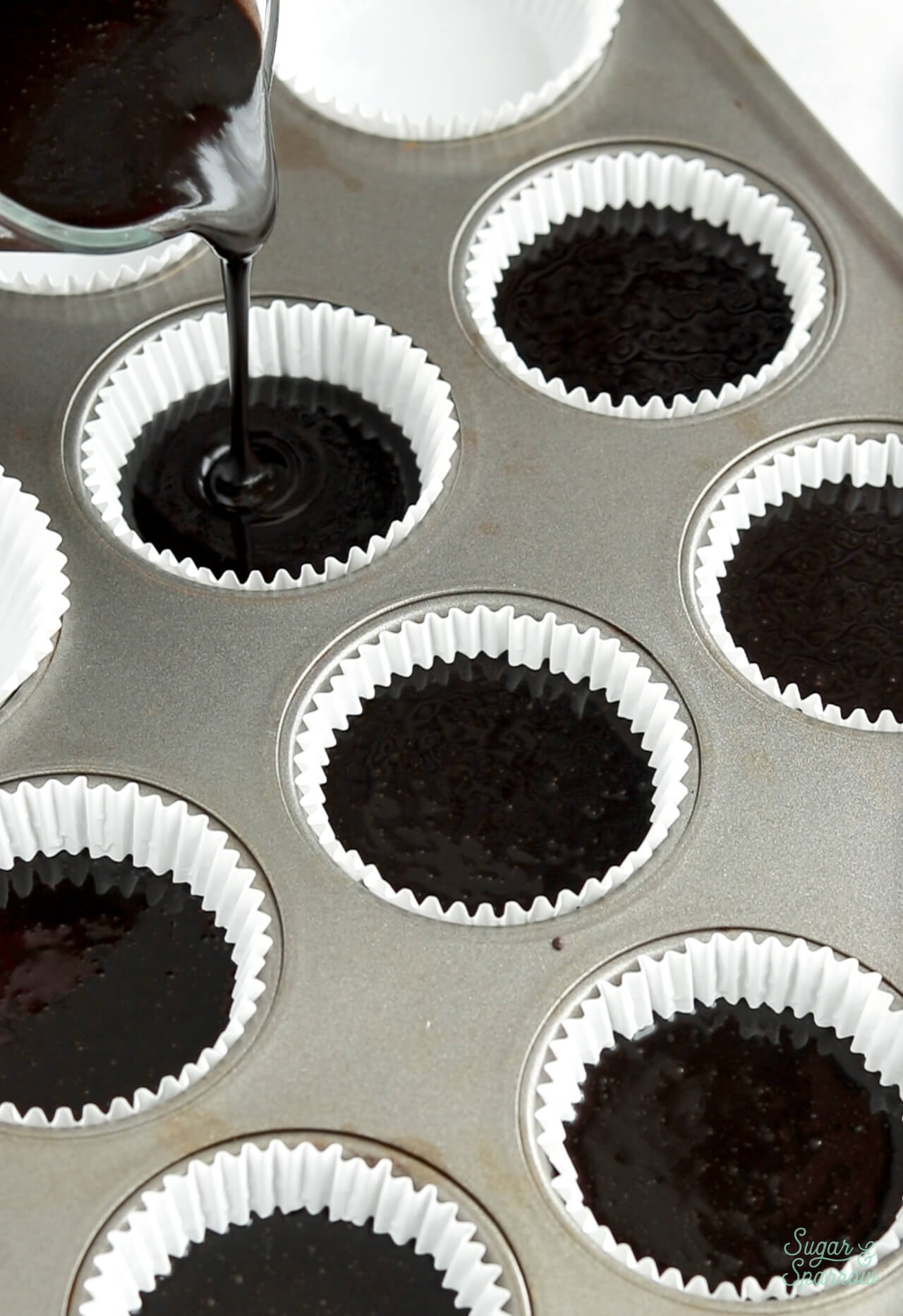 pour black velvet cupcake batter into cupcake liners