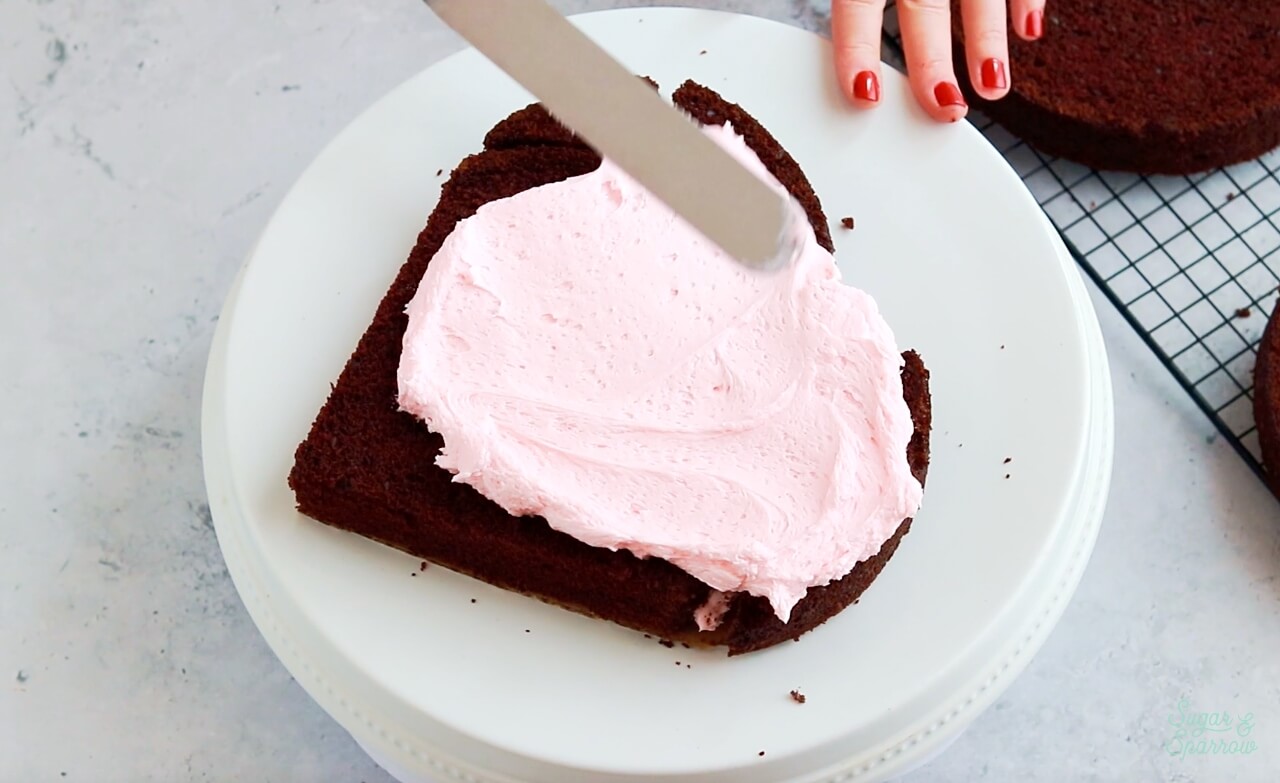 frosting a heart shaped cake