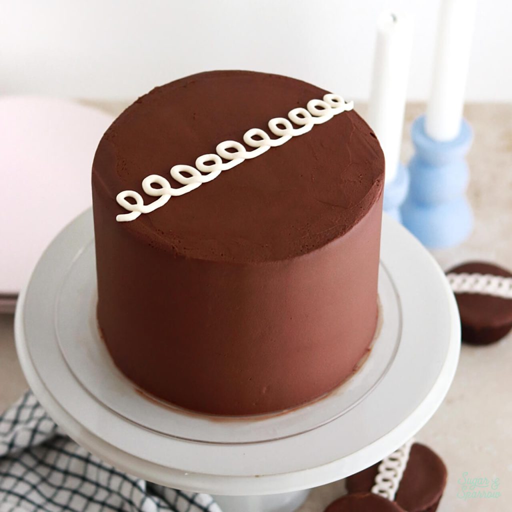 chocolate cake with marshmallow filling and chocolate ganache frosting