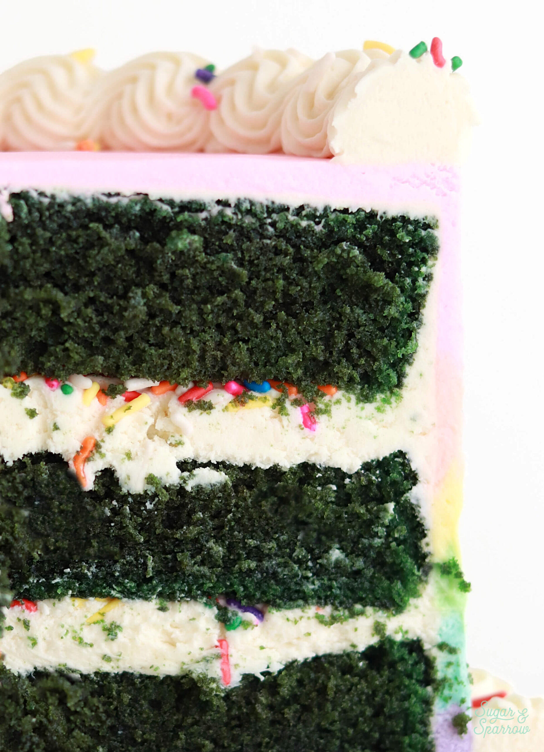 green velvet cake with rainbow buttercream frosting