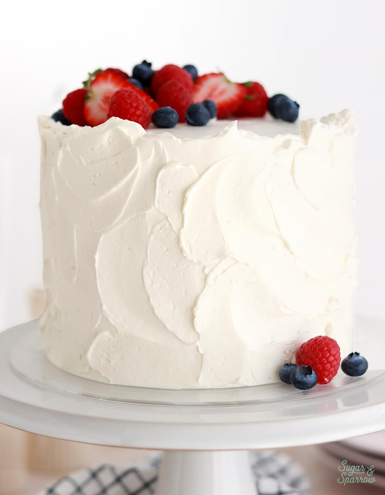 white cake recipe with vanilla buttercream and berries