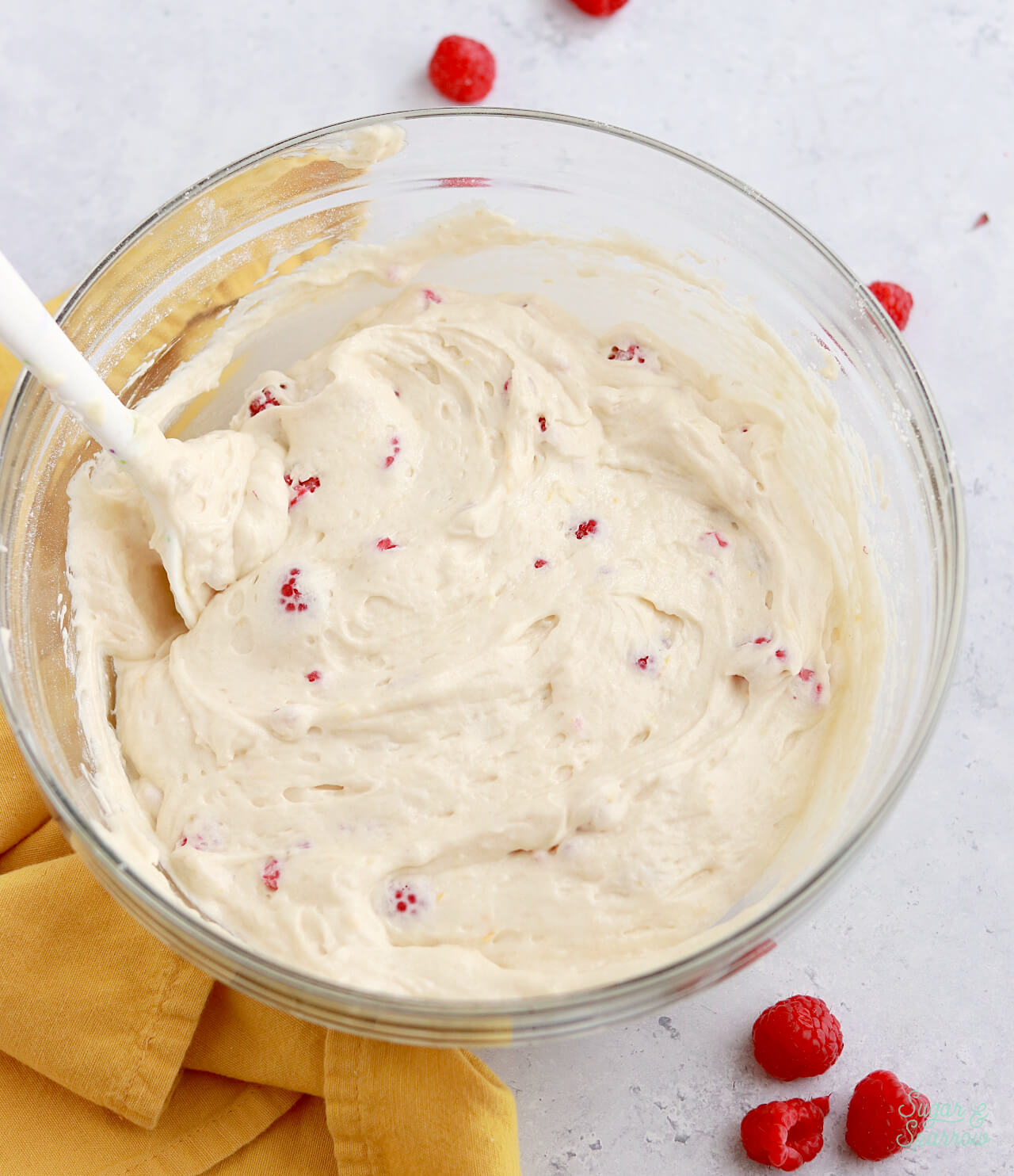 adding raspberries to lemon cake recipe