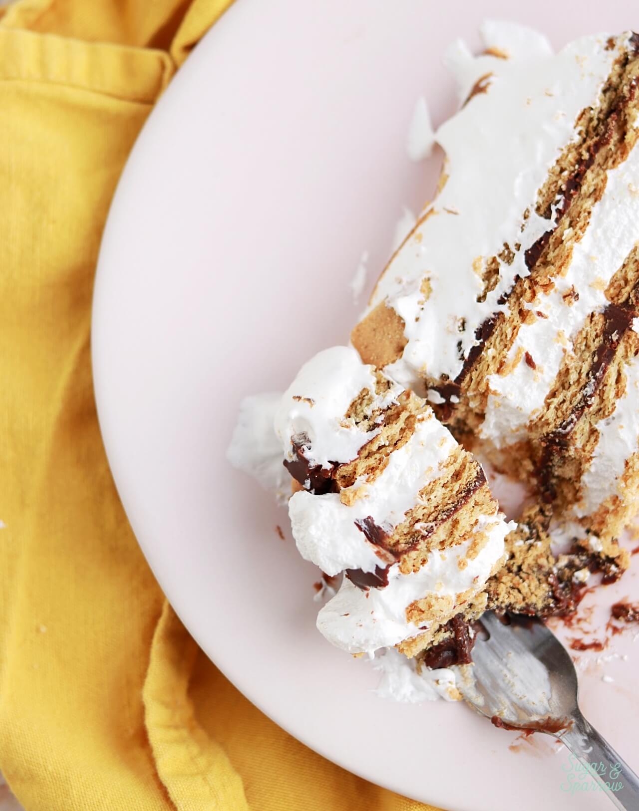 smores cake with homemade marshmallow creme, chocolate ganache, and graham crackers