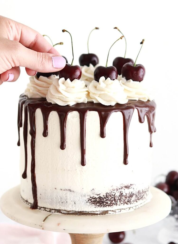 black forest cake recipe with homemade cherry filling and whipped cream frosting
