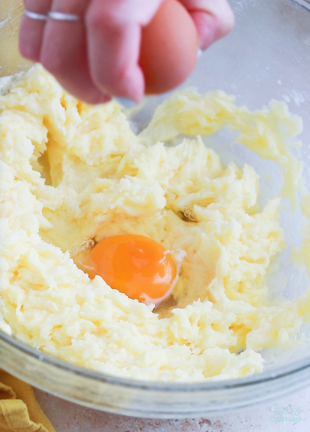 adding eggs to cake batter