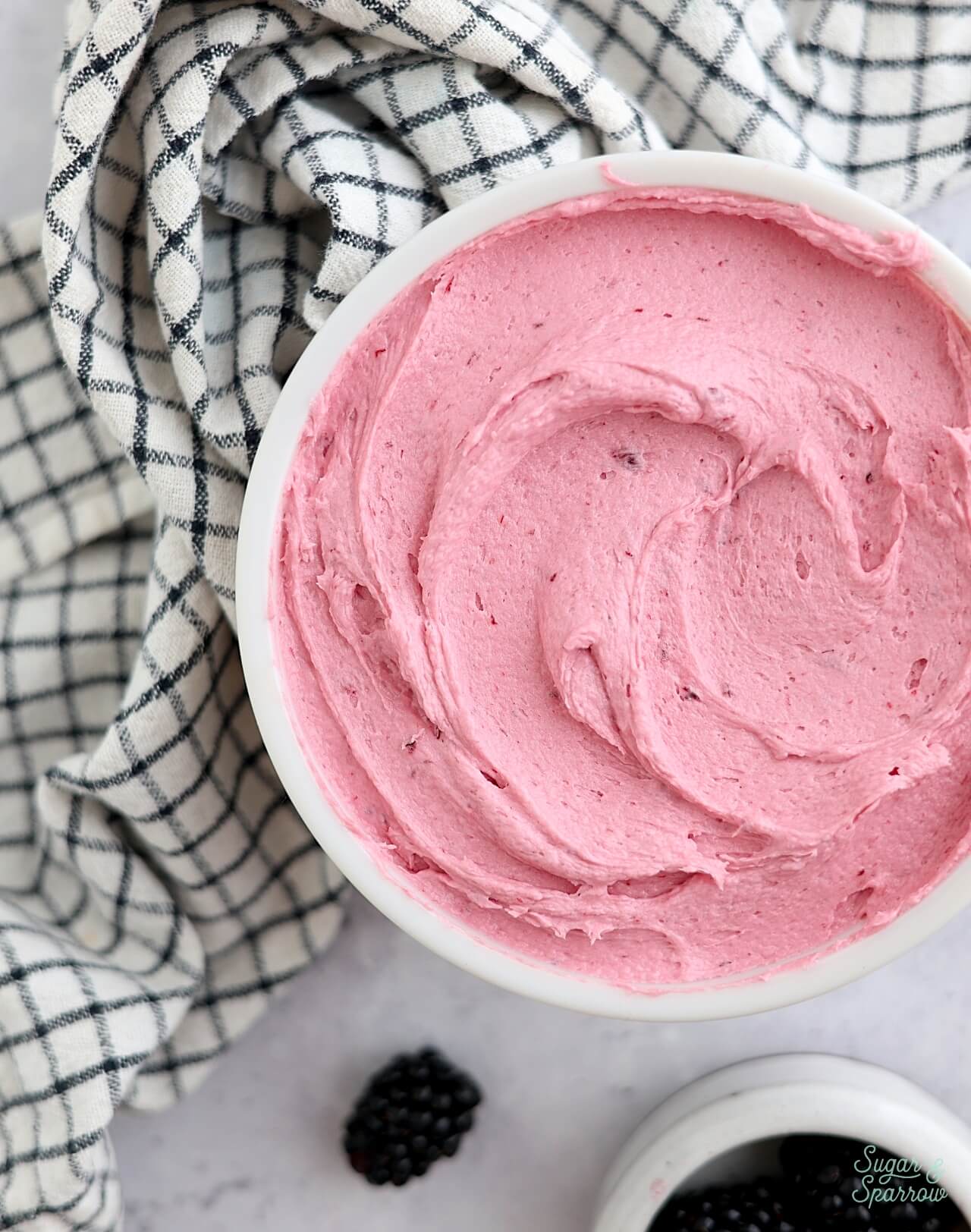 blackberry buttercream frosting in a bowl
