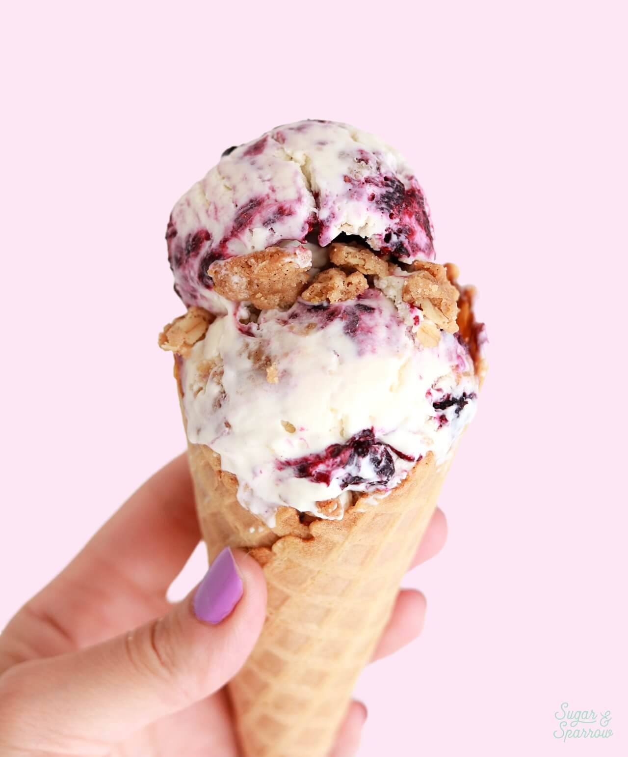 berry crisp ice cream in a waffle cone