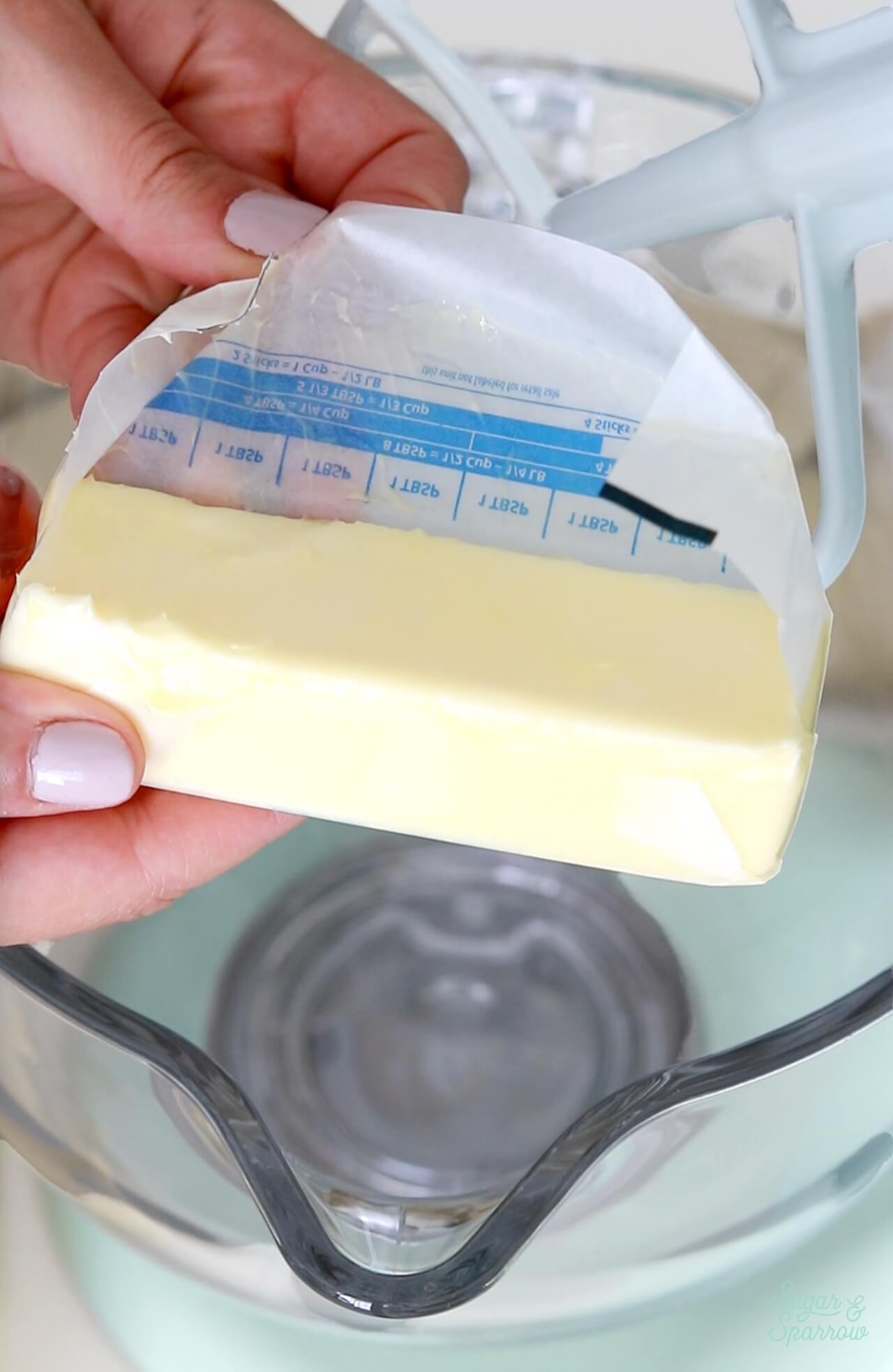 holding a stick of butter