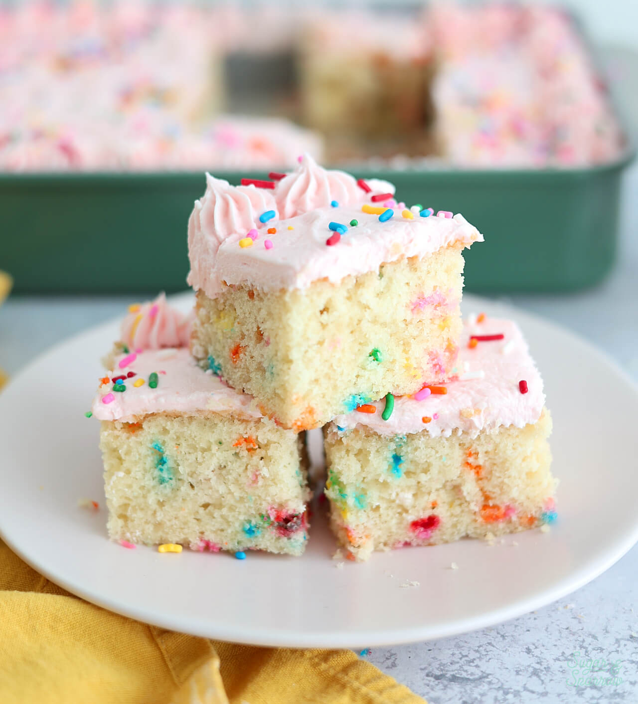 funfetti sheet cake slices stacked