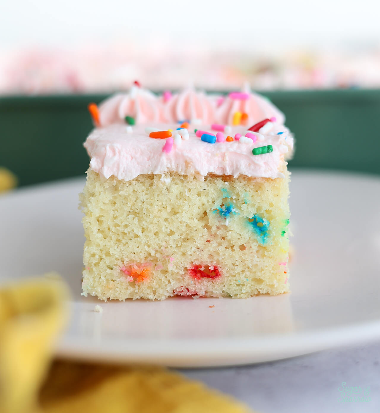 funfetti sheet cake slice on a plate