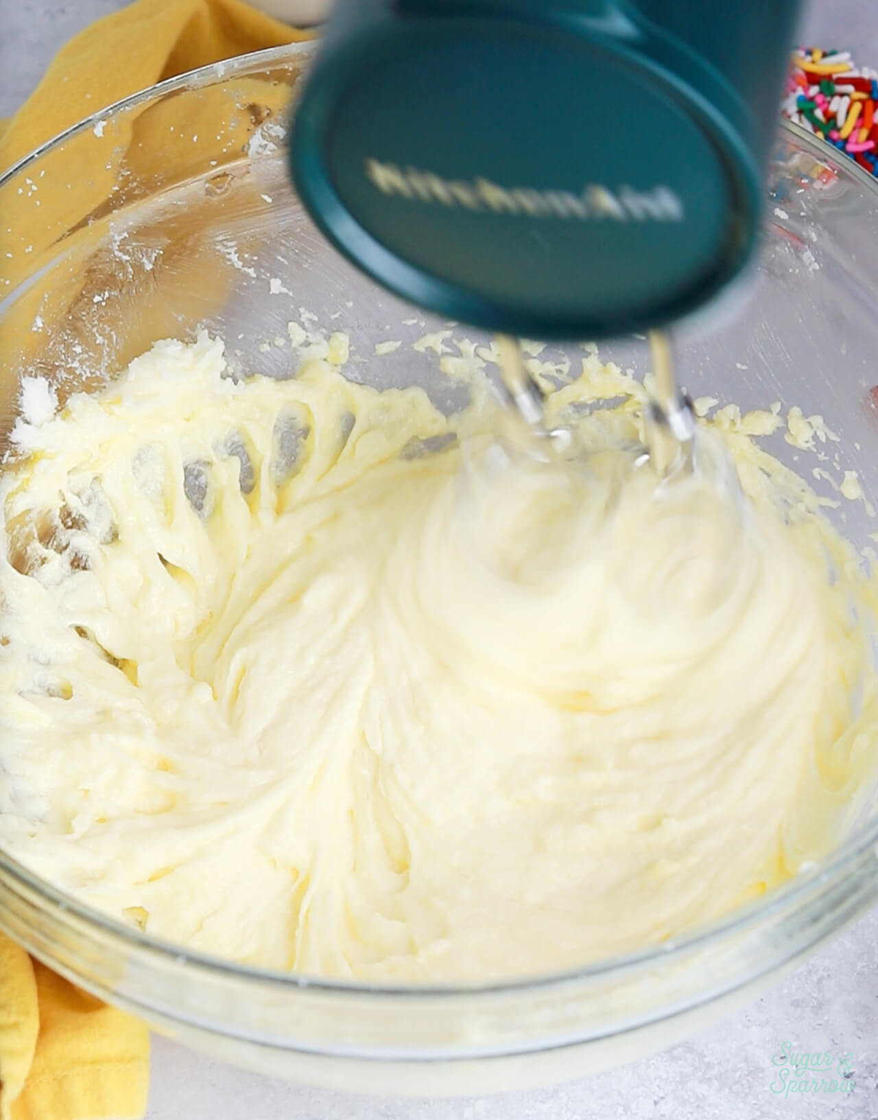 mixing eggs into cake batter one at a time