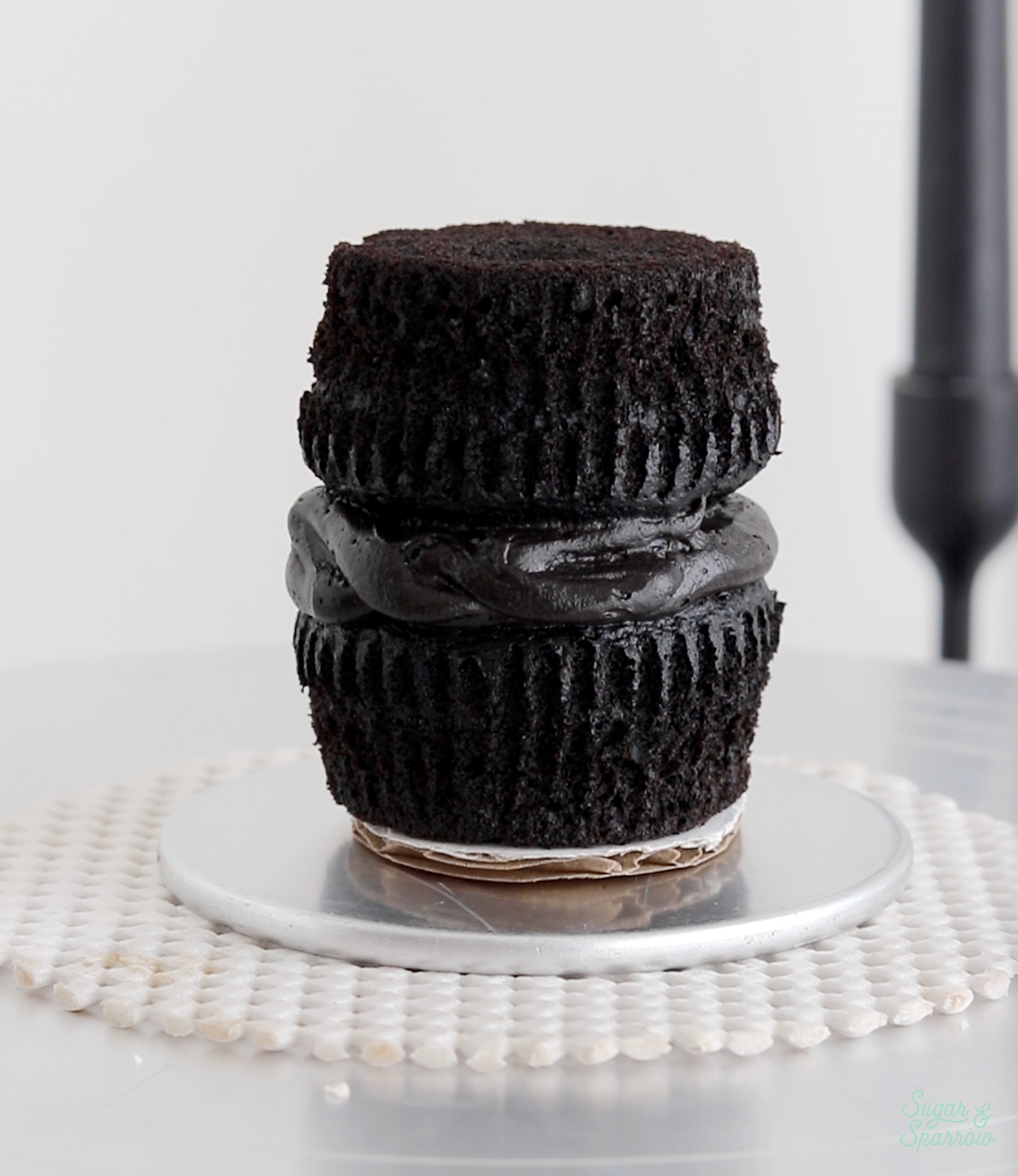 stack of two black velvet cupcakes