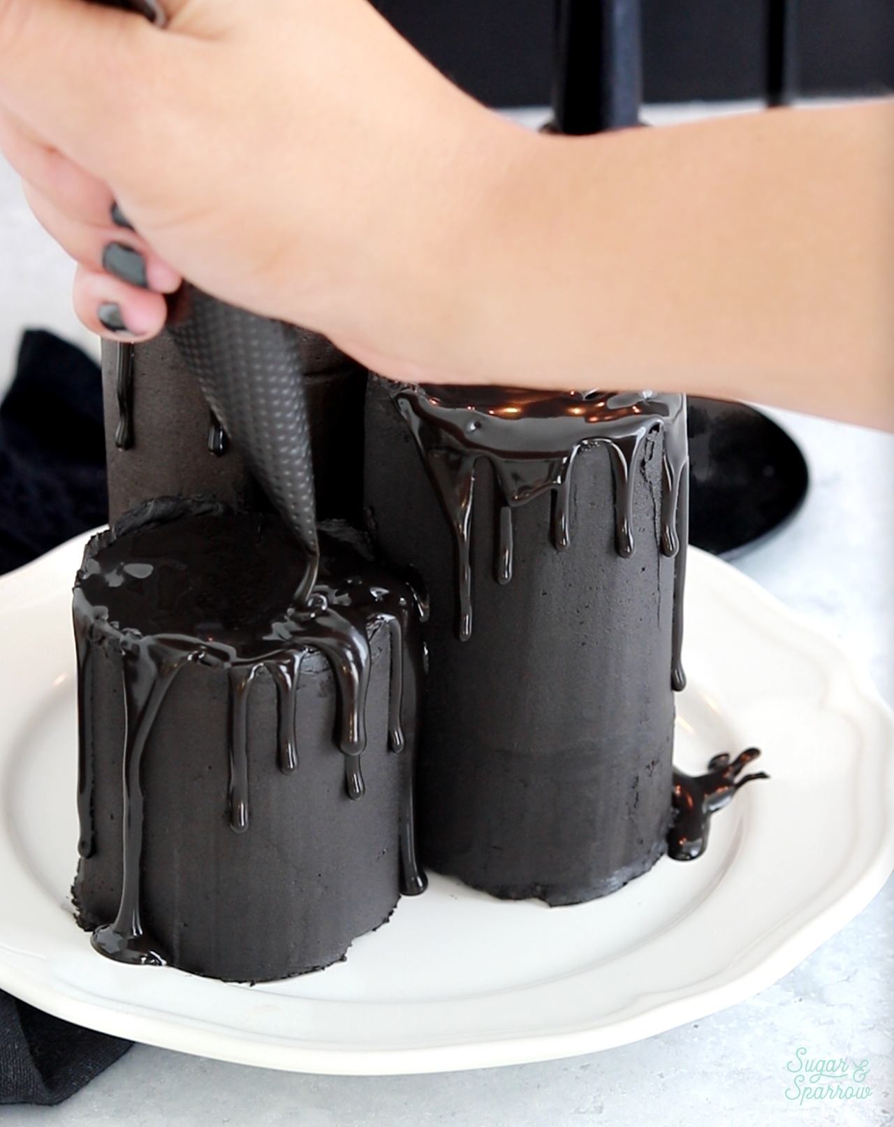 black chocolate ganache on candle cupcakes