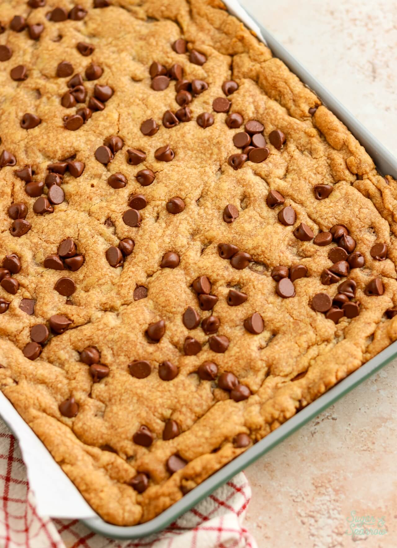 brown butter pumpkin chocolate chip cookie bars in a sheet pan