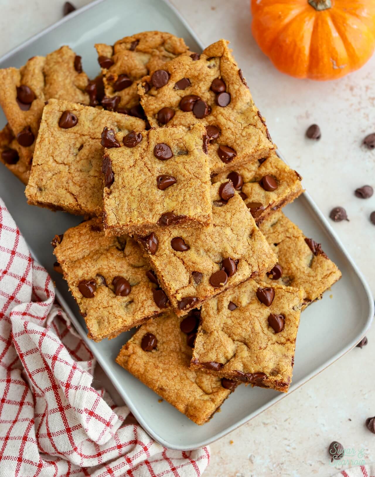 pumpkin chocolate chip cookie bars on a tray