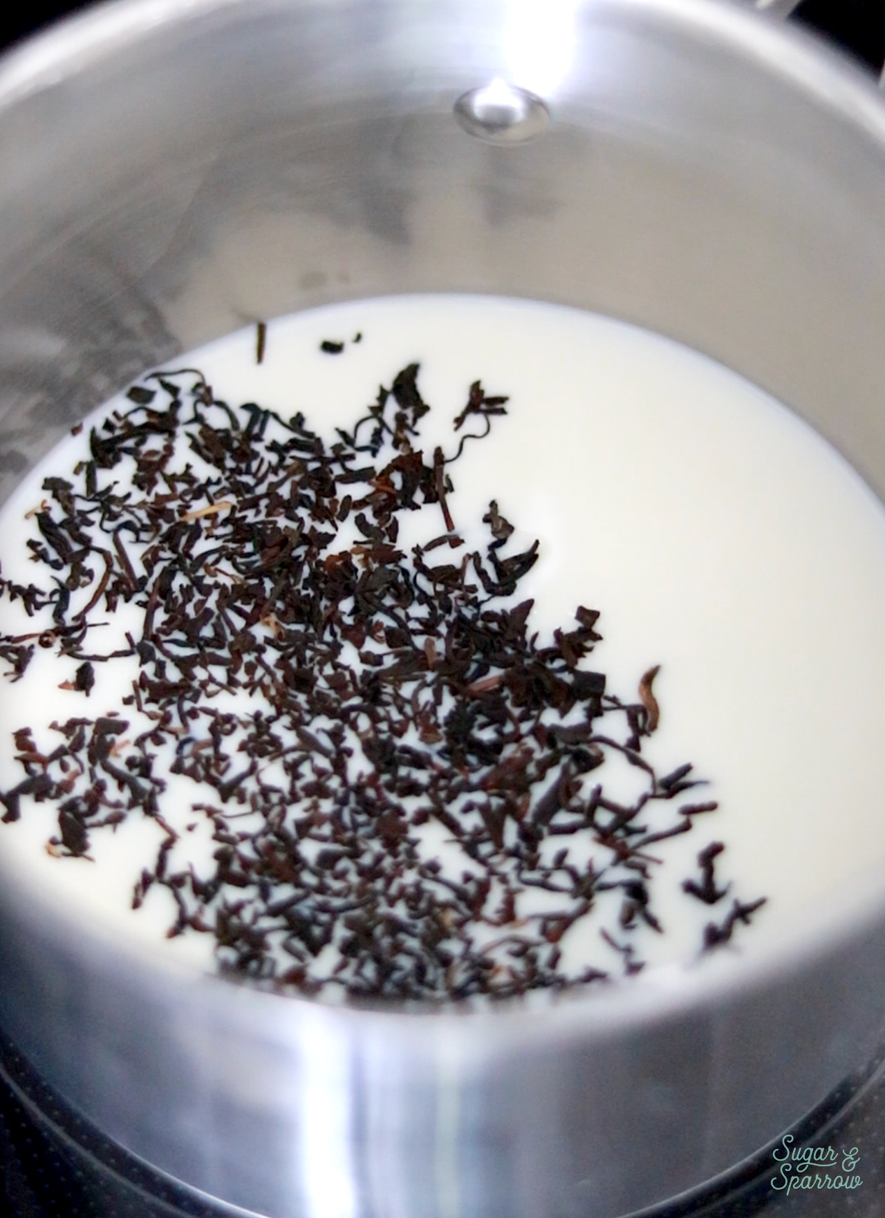 combining milk and earl grey tea in a saucepan