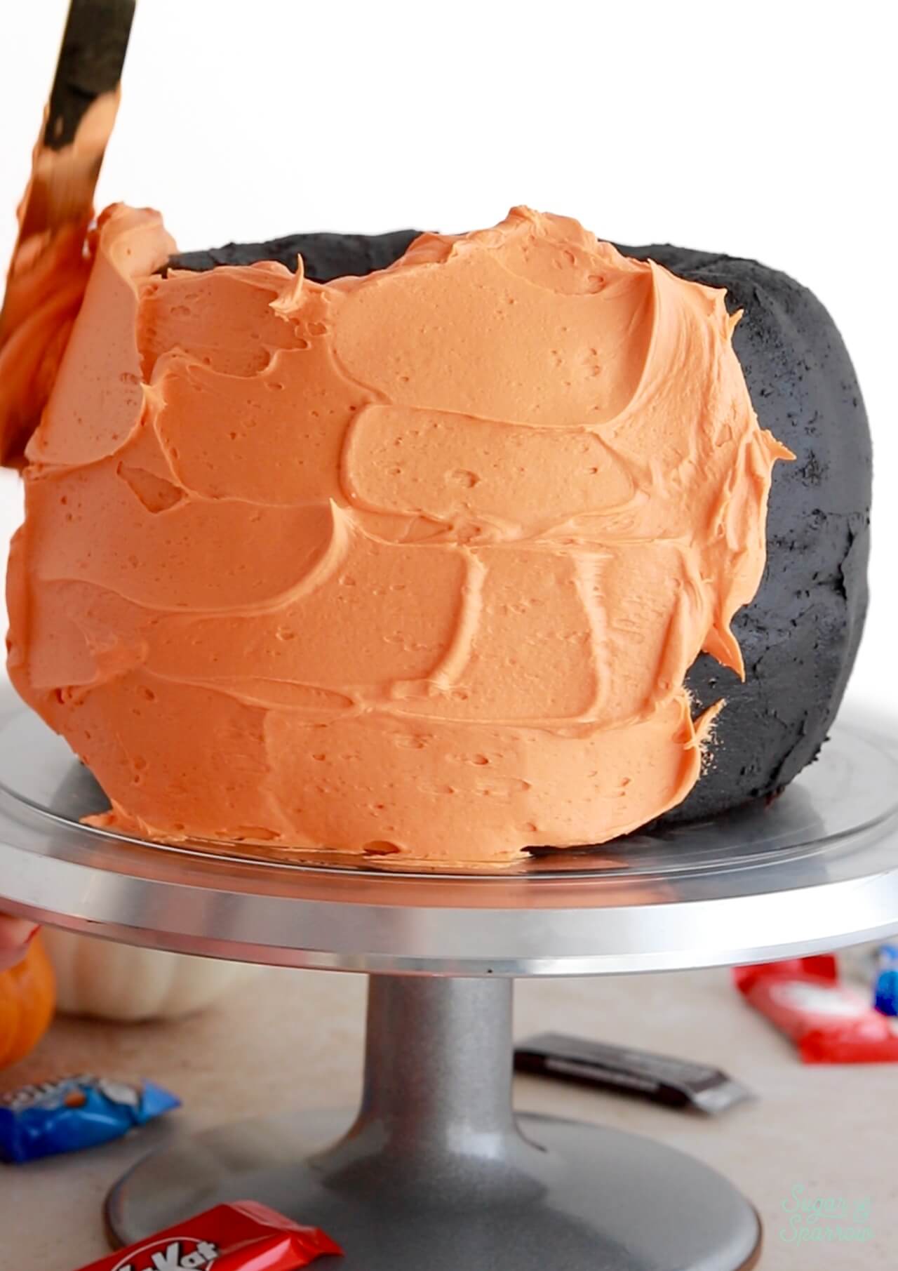 creating a buttercream pumpkin shaped cake