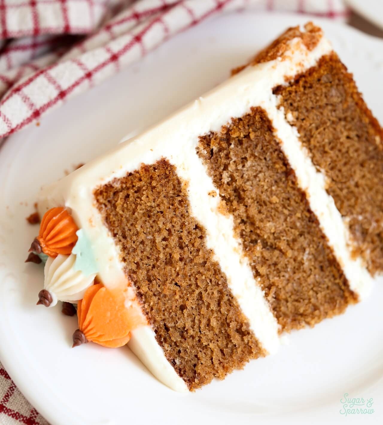 pumpkin layer cake with cream cheese frosting slice on a plate