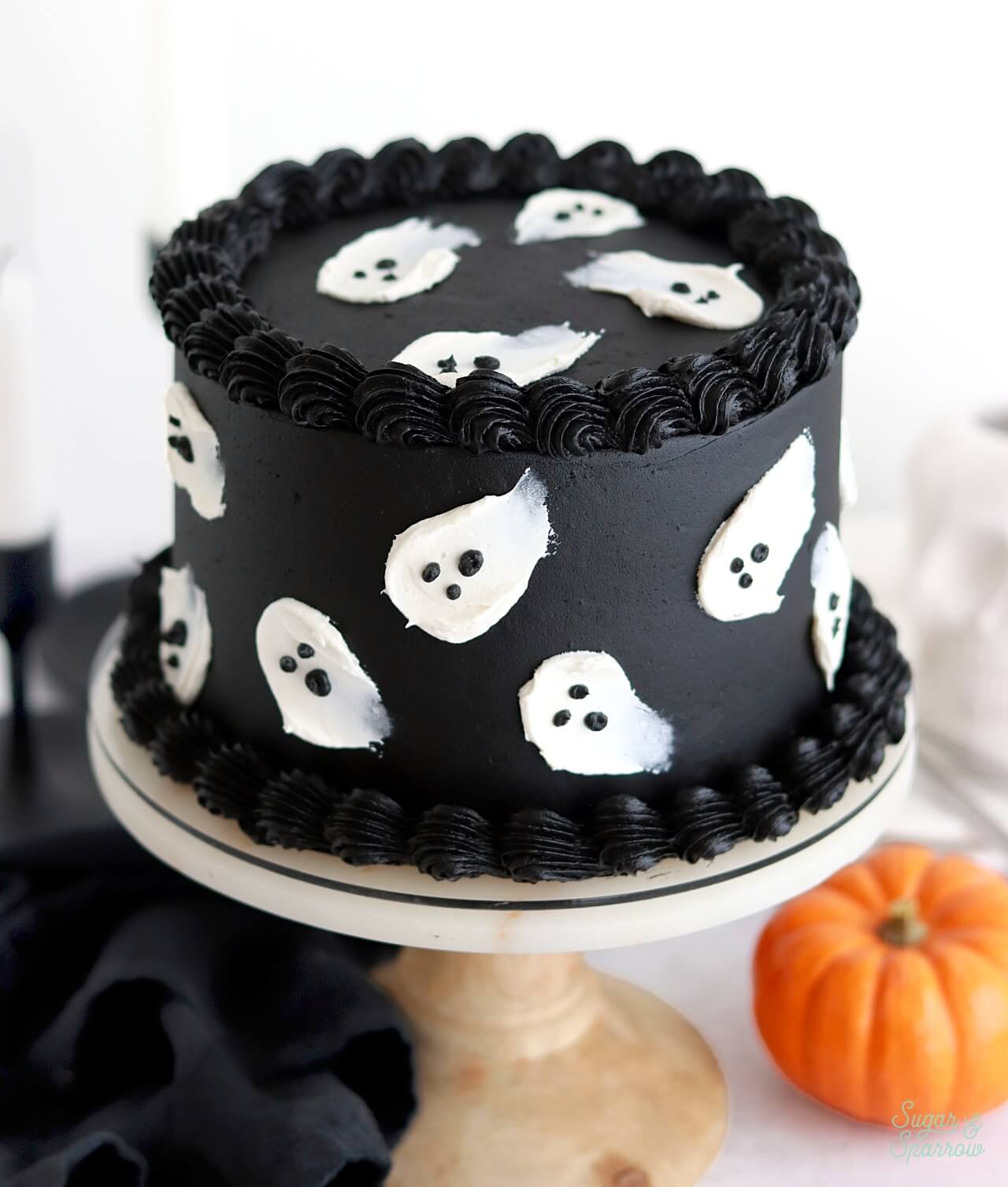 black velvet cake with buttercream ghost decorations
