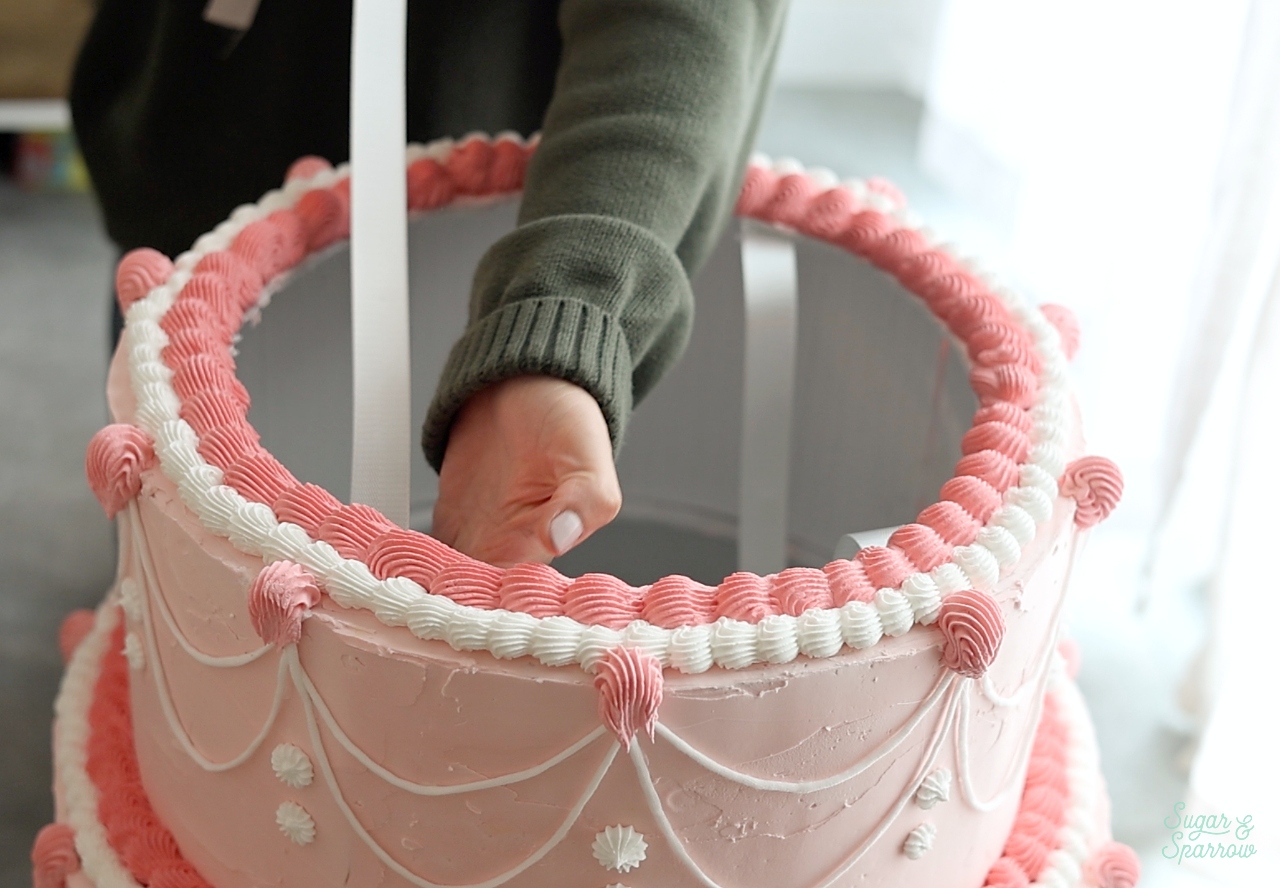 attaching straps to a cake costume