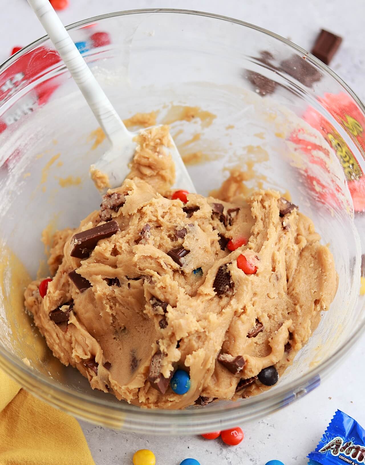 cookie dough with pieces of halloween candy folded in