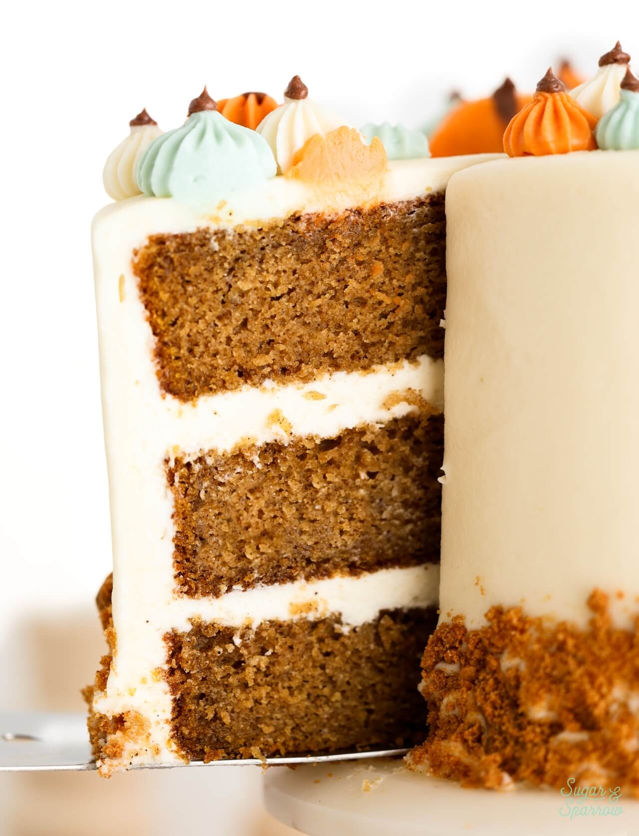 pumpkin cake with cream cheese frosting sliced