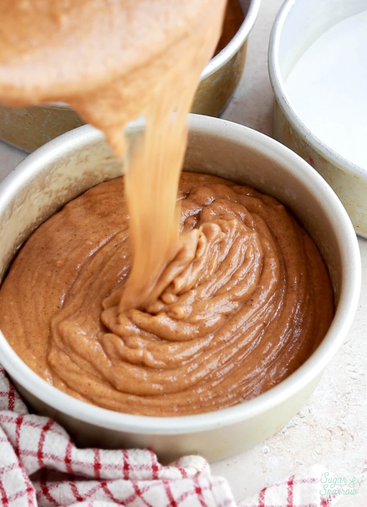 pumpkin cake batter in a 6 inch pan