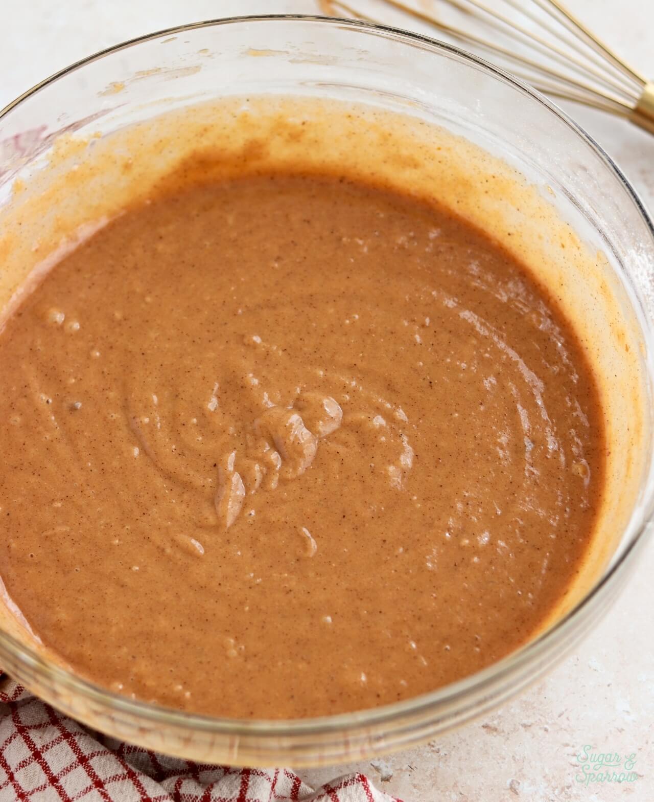 pumpkin cake batter in a glass bowl