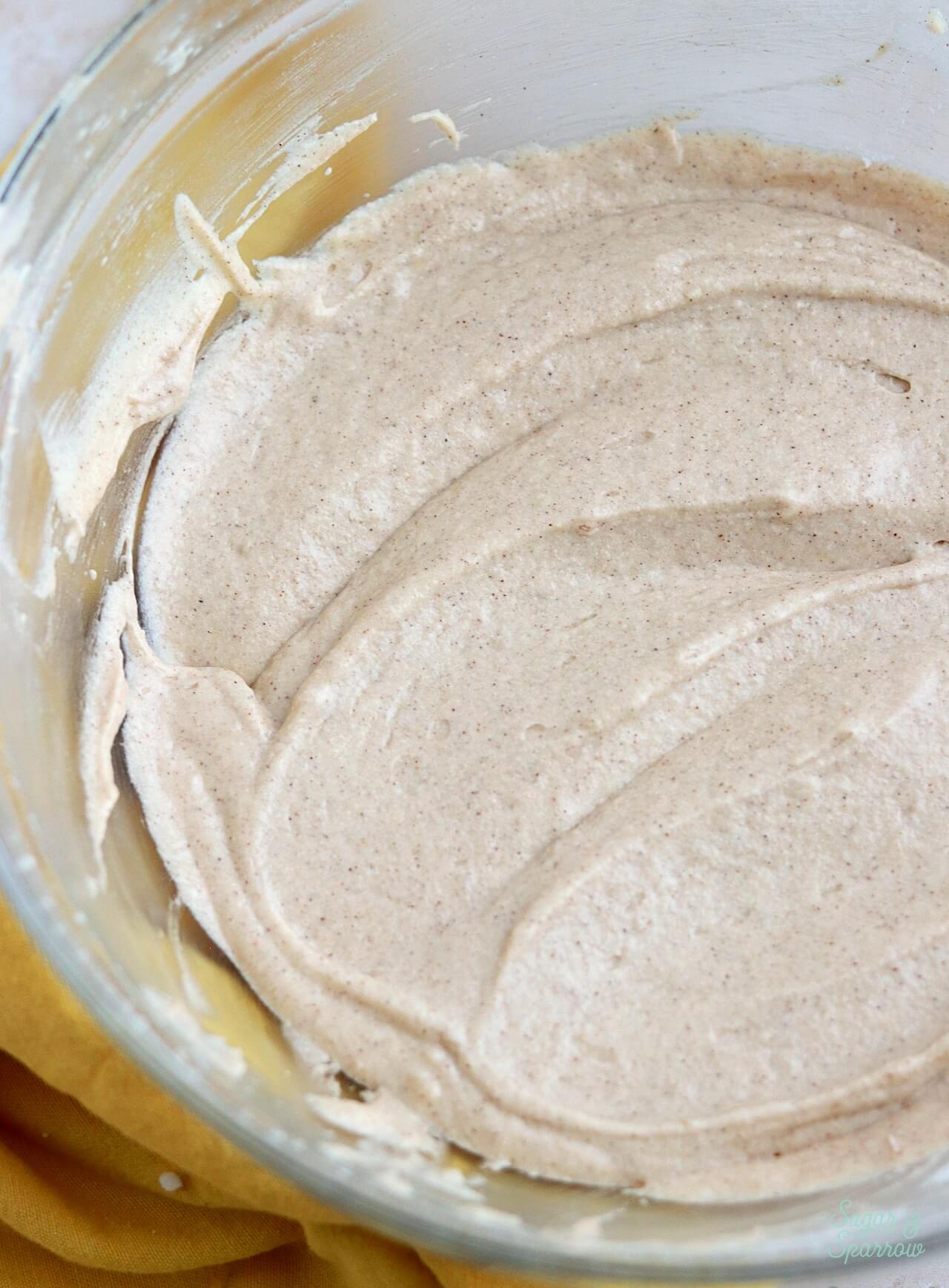 chai cupcake batter in a glass mixing bowl