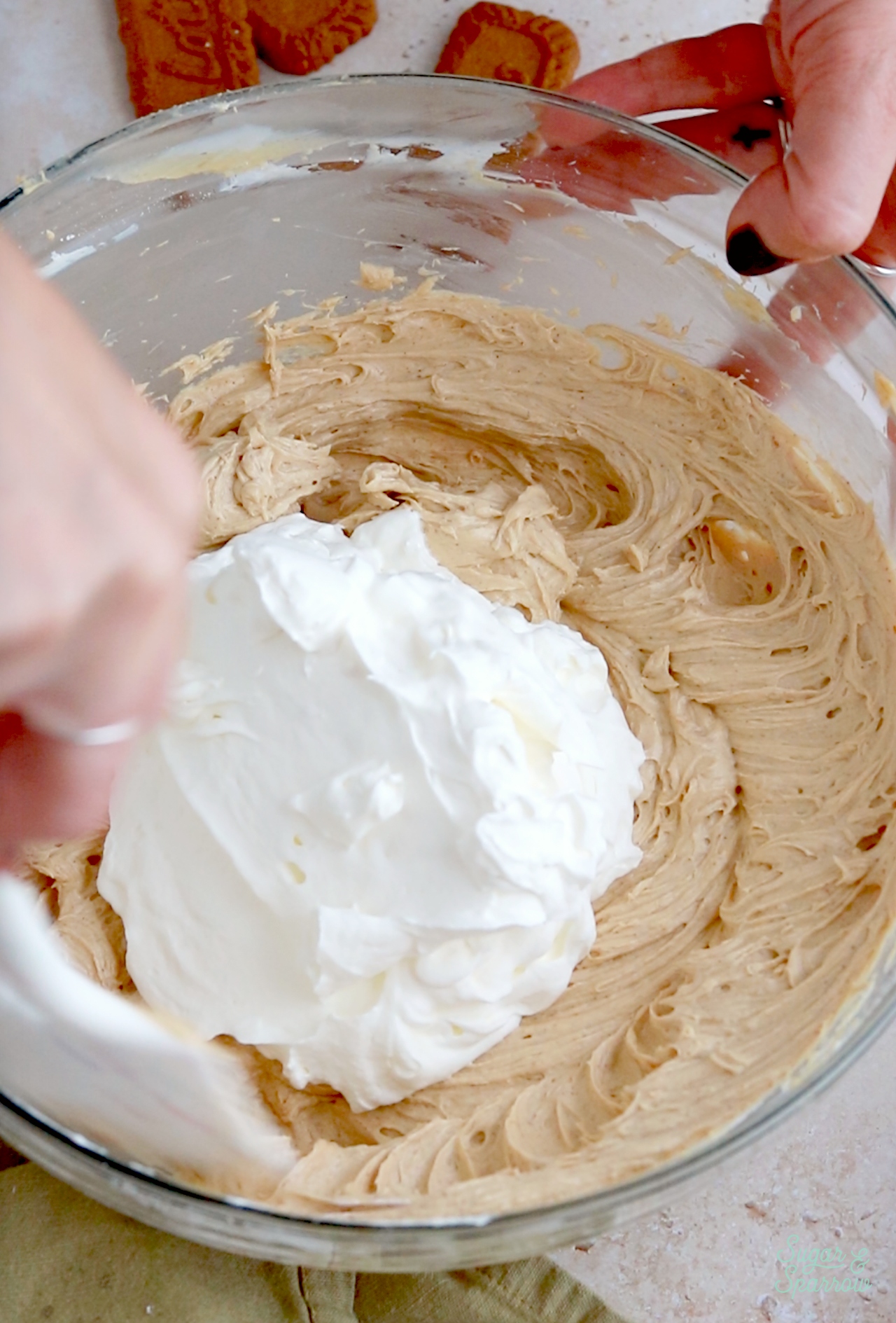 folding whipped cream into no-bake cheesecake filling