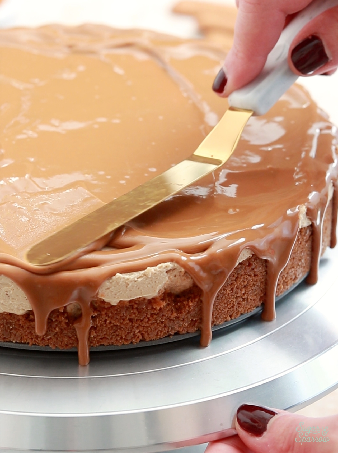 melted biscoff cookie butter drip on cheesecake