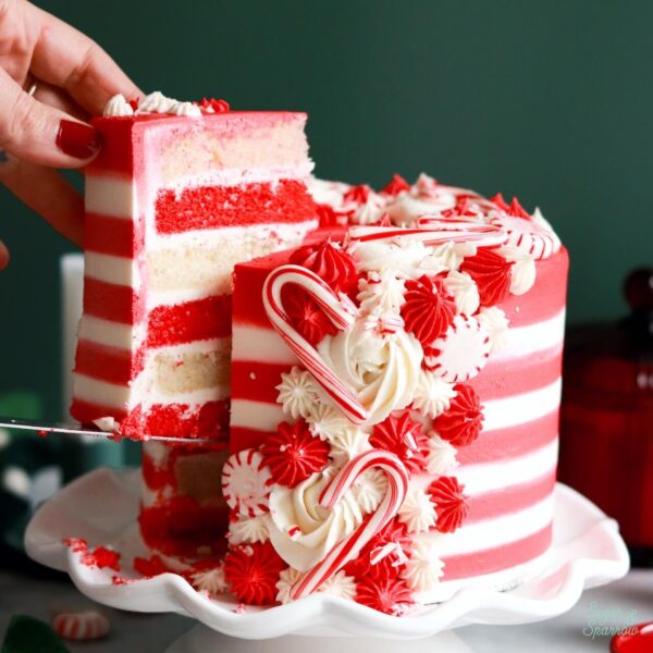 candy cane cake with red and white cake layers and striped buttercream