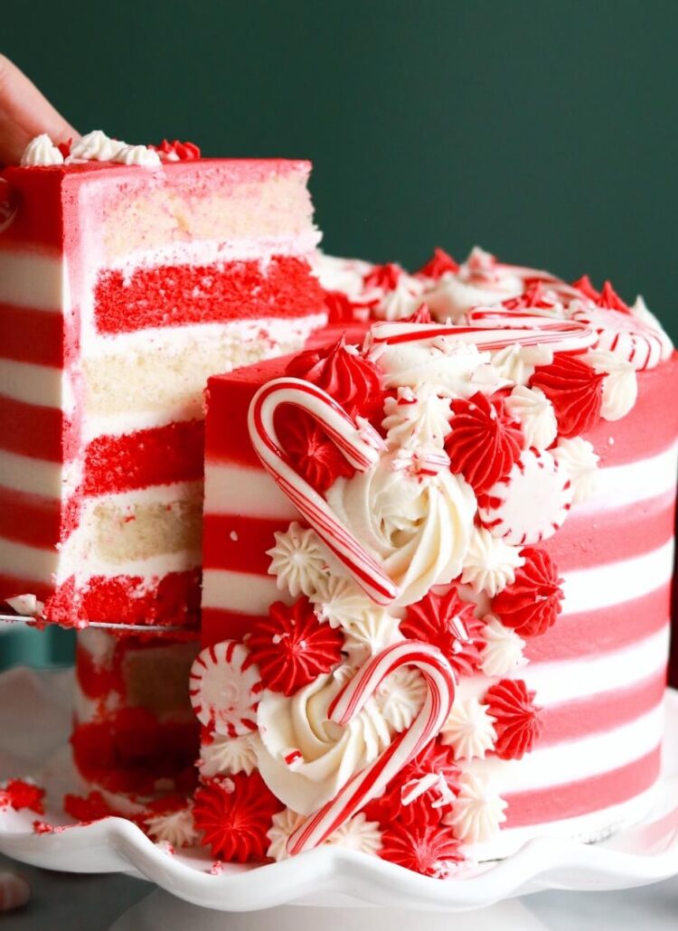 candy cane cake with red and white cake layers and striped buttercream