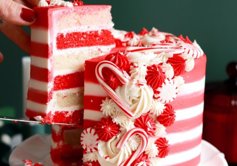 candy cane cake with red and white cake layers and striped buttercream