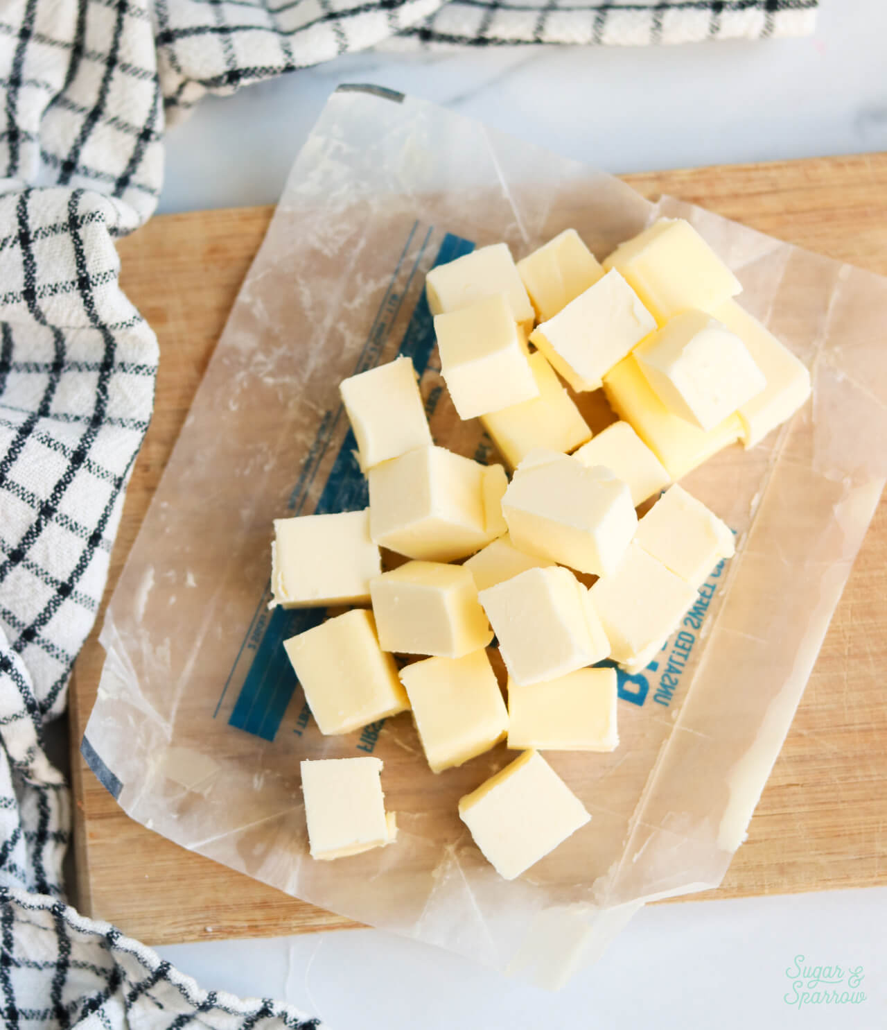 cubed butter on a cutting board