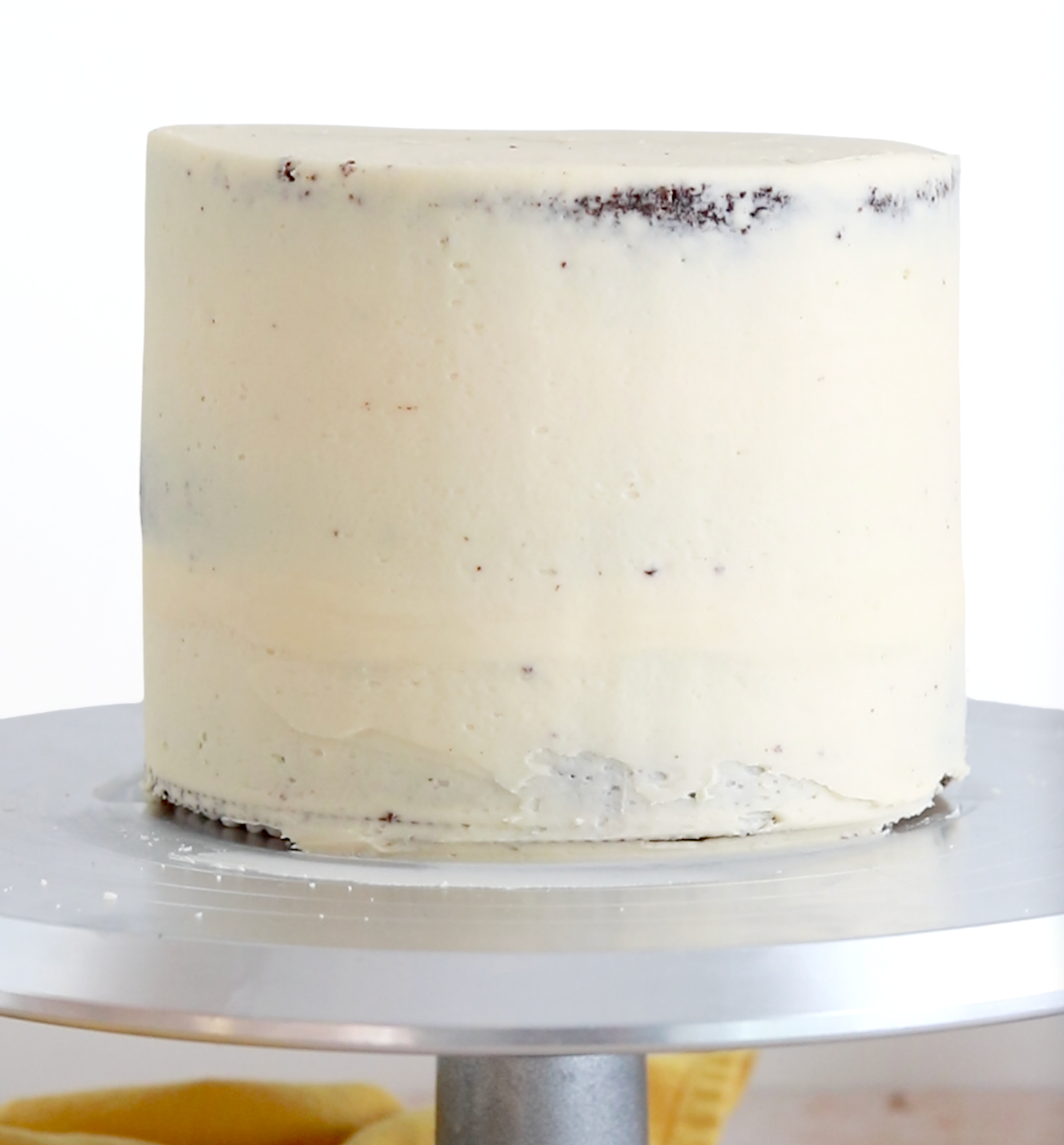 crumb coating a cake with caramel buttercream