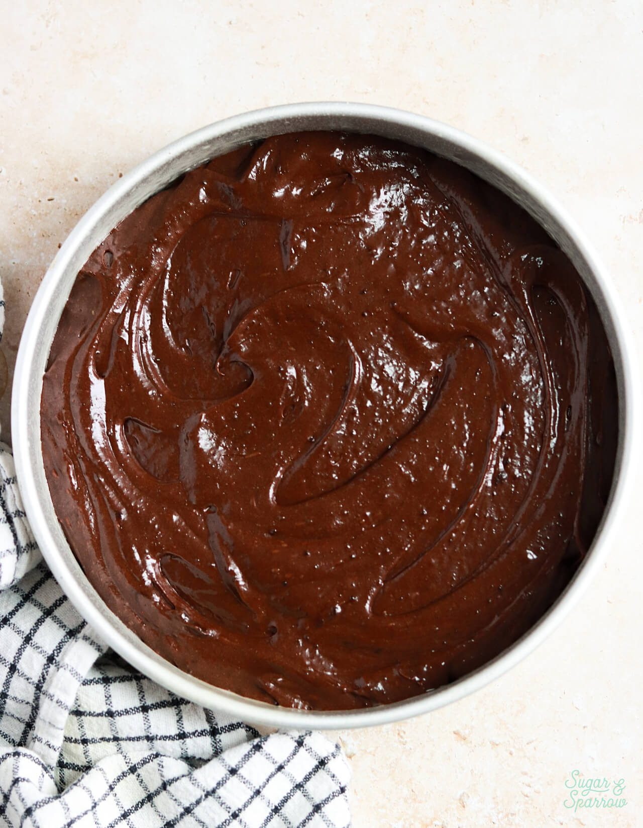 flourless chocolate cake batter in a round pan