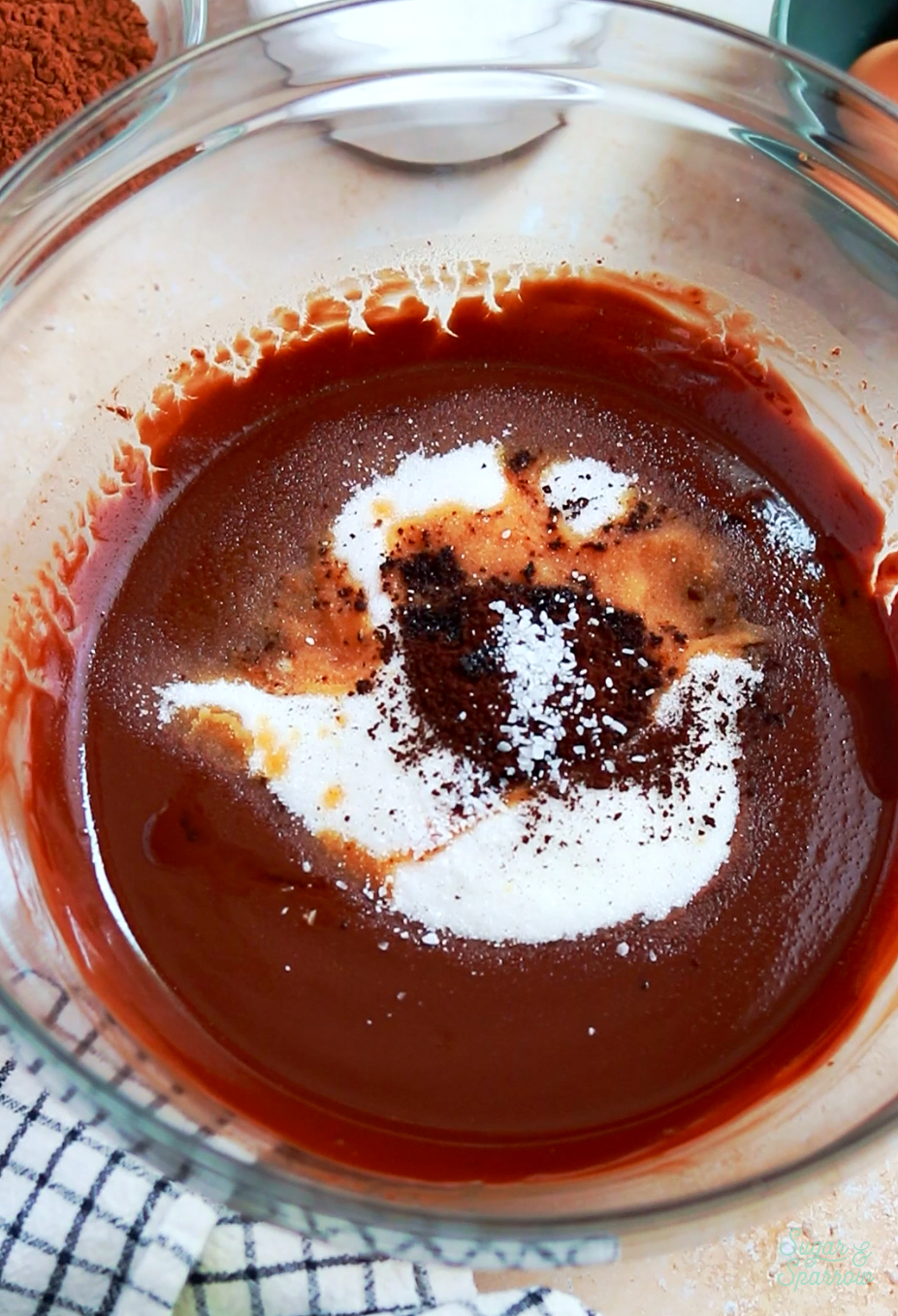 Adding ingredients to flourless chocolate cake recipe