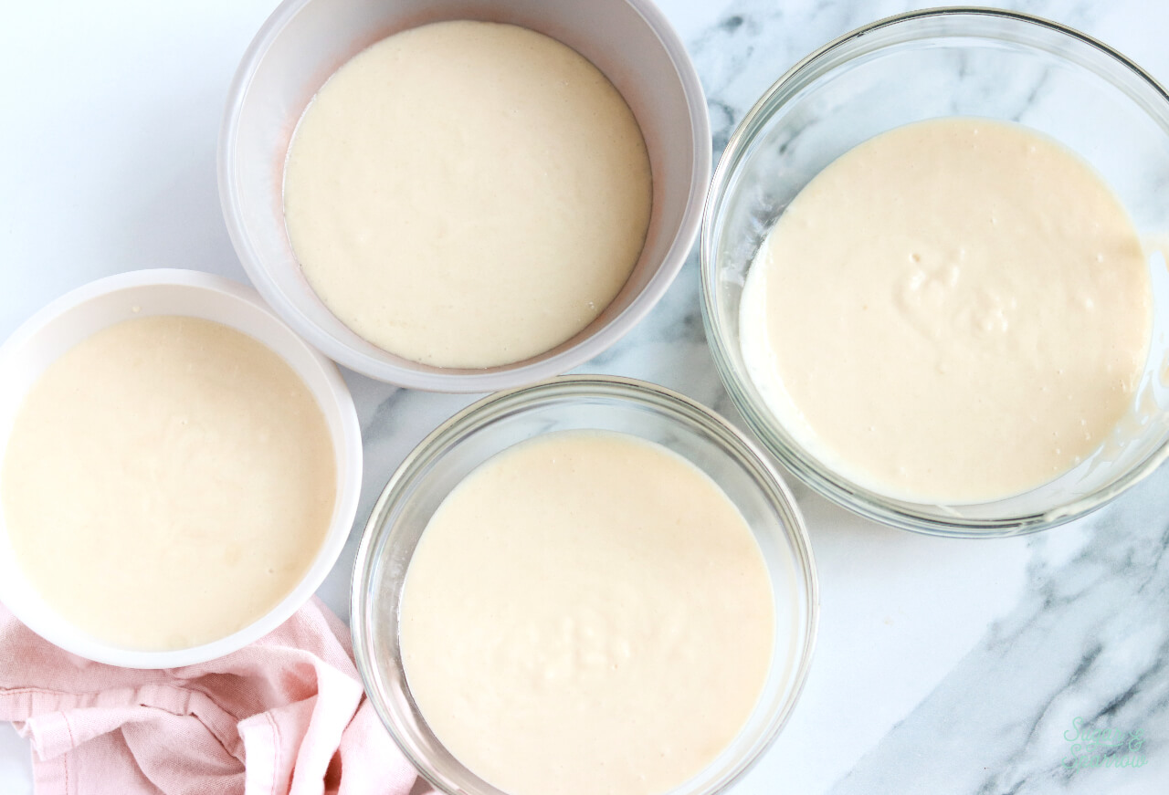 cake batter divided into four bowls