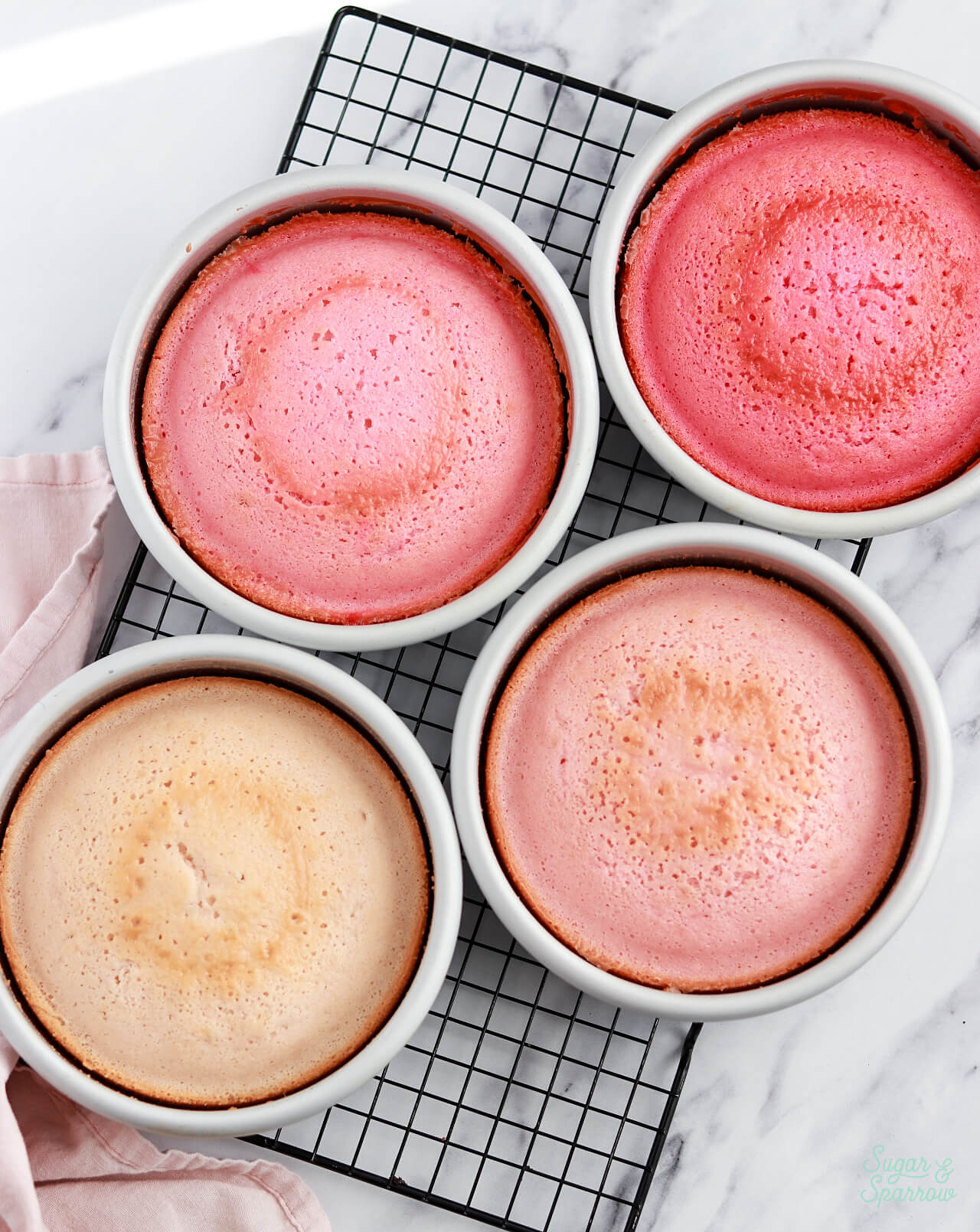 ombre pink cake layers baked in pans